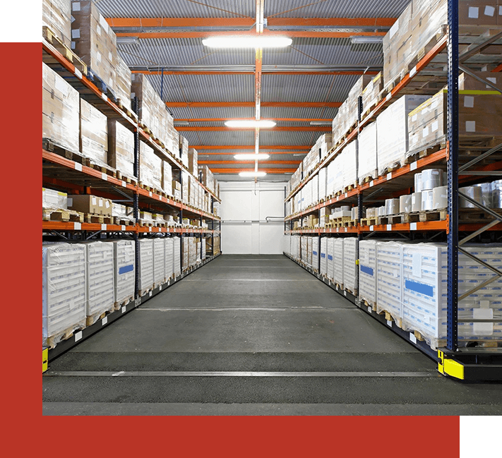 A warehouse with many shelves of boxes and packages.